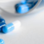 Canva-Depth-Photography-of-Blue-and-White-Medication-Pill